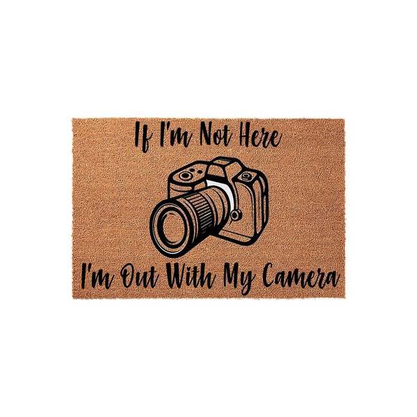 Photographer Welcome Doormat featuring a natural coir texture with a black camera illustration and the text If I am Not Here I am Out With My Camera, making a fun entrance decor piece for any photography enthusiast or hobbyist