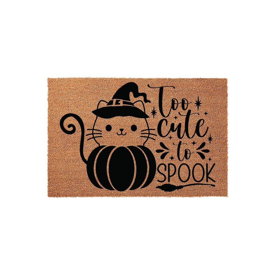 Too Cute to Spook Halloween doormat featuring a black cat wearing a witch hat while sitting inside a pumpkin, printed on a natural coir fiber mat with a plain white background for a festive seasonal entryway decor look.