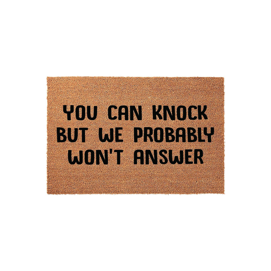 Funny You Can Knock But We Probably Won't Answer coir doormat featuring bold black text on a natural brown fiber background, designed as a humorous front porch welcome mat for your home entrance against a clean white studio