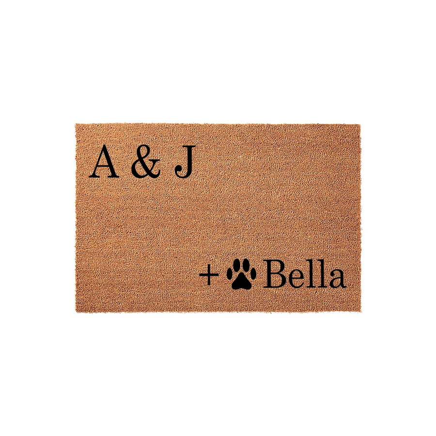 Personalized coir doormat featuring a natural brown fiber texture with black printed text that includes a plus sign, a paw print icon, and custom initials, creating a welcoming entryway decor piece for pet-loving households.