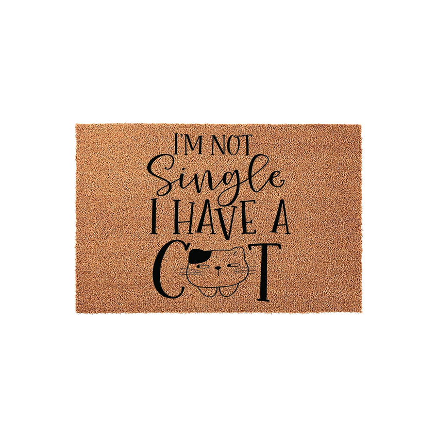 Funny Cat Lover Doormat featuring natural coir fibers and black text that reads I am not single I have a cat, with a cute illustrated feline face replacing the letter A in the word cat on this humorous indoor or outdoor entryway