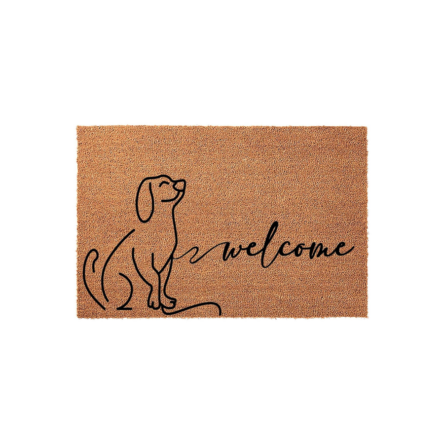 Dog Welcome Doormat featuring a minimalist black line art illustration of a sitting puppy on a natural brown coir fiber background, with the word welcome written in elegant cursive script to greet guests at your front door