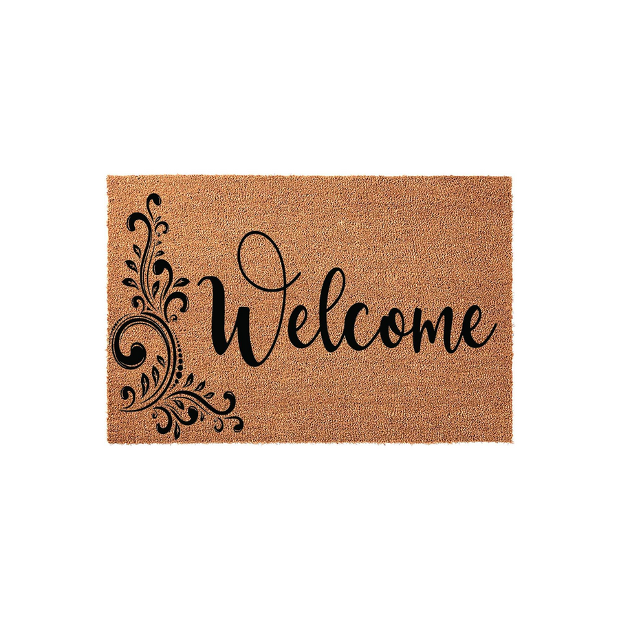 Welcome coir doormat featuring a natural tan fiber texture and elegant black script lettering, accented by a decorative floral flourish design on the left side to create a warm and inviting entryway for your home front porch.