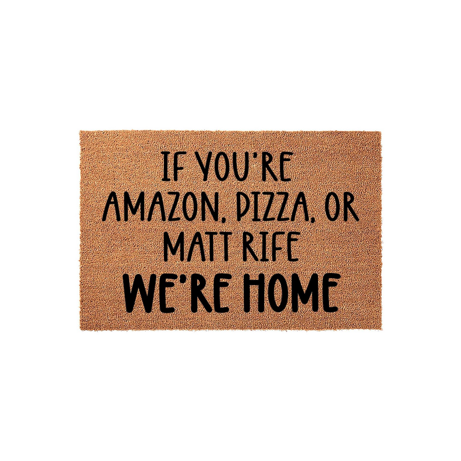 Funny Welcome Doormat featuring a natural coir texture and bold black text that reads If You Are Amazon, Pizza, Or Matt Rife We Are Home, making it a humorous front porch decor piece for any home entrance or apartment entryway.