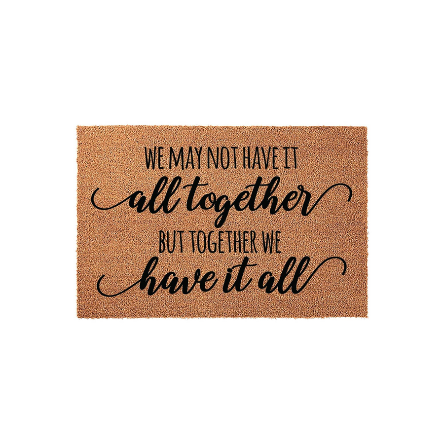 Family Quote Coir Doormat featuring the text We may not have it all together but together we have it all in a mix of modern sans-serif and elegant script fonts, set against a natural brown textured coconut fiber background on a