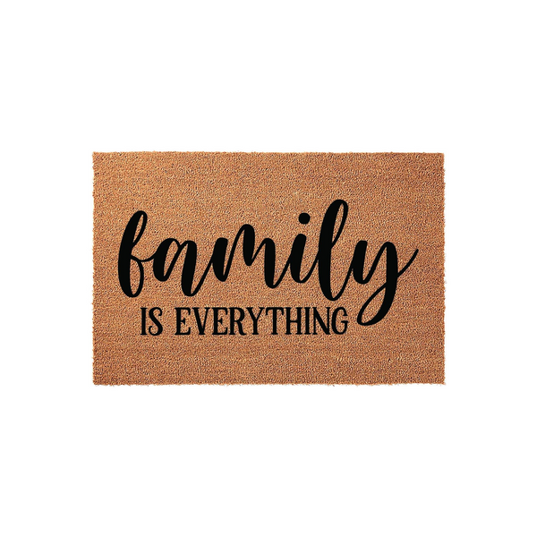 Family Is Everything coir doormat featuring a natural brown fiber texture and bold black script lettering, providing a warm and welcoming entrance decor piece for any home entryway or front porch setting on a clean white