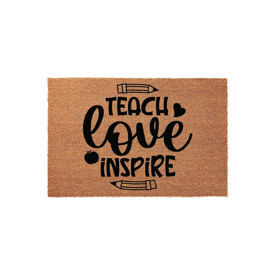 Teacher appreciation coir doormat featuring the words Teach Love Inspire in black lettering, accented with pencil and apple icons on a natural brown textured background, perfect for a classroom entrance or a teacher home decor