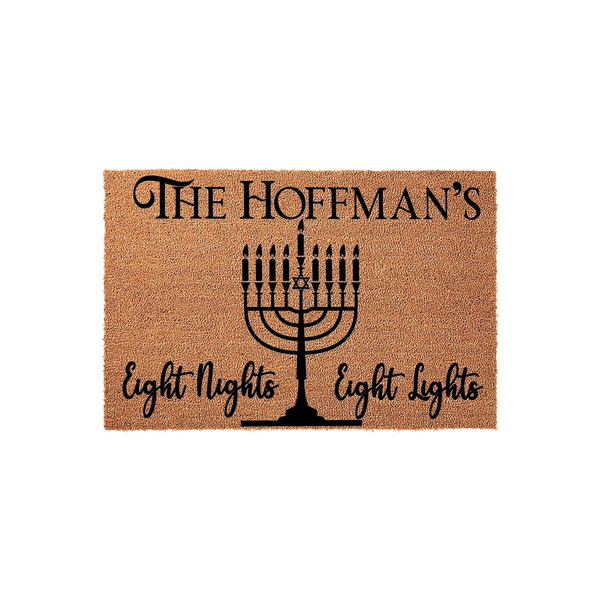 Personalized Hanukkah doormat featuring a black menorah graphic and the text Eight Nights Eight Lights, set against a natural coir fiber background to welcome guests during the holiday season with a custom family name display.
