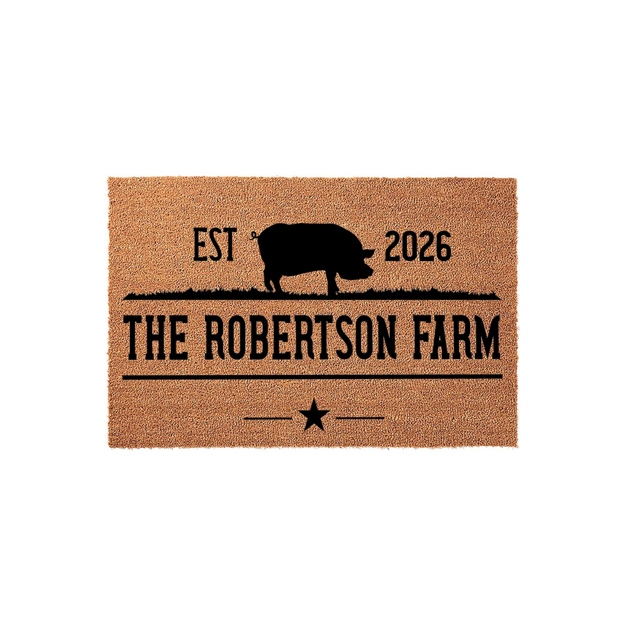 Personalized farm doormat featuring a black pig silhouette, the established year, and custom family name text printed on a natural coir fiber mat, creating a rustic farmhouse entrance decor piece for your front porch or home