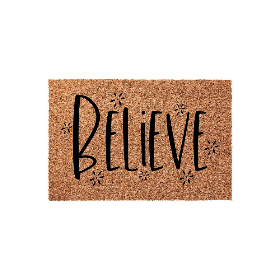 Believe coir doormat featuring a natural tan fiber texture with the word Believe printed in a bold black script font, accented by small decorative starburst icons on a clean white background for a modern farmhouse entryway style.