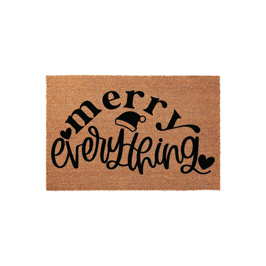 Merry Everything Christmas coir doormat featuring black script lettering and a festive Santa hat icon on a natural brown fiber background, creating a cheerful holiday welcome for your front porch entrance during the winter season.