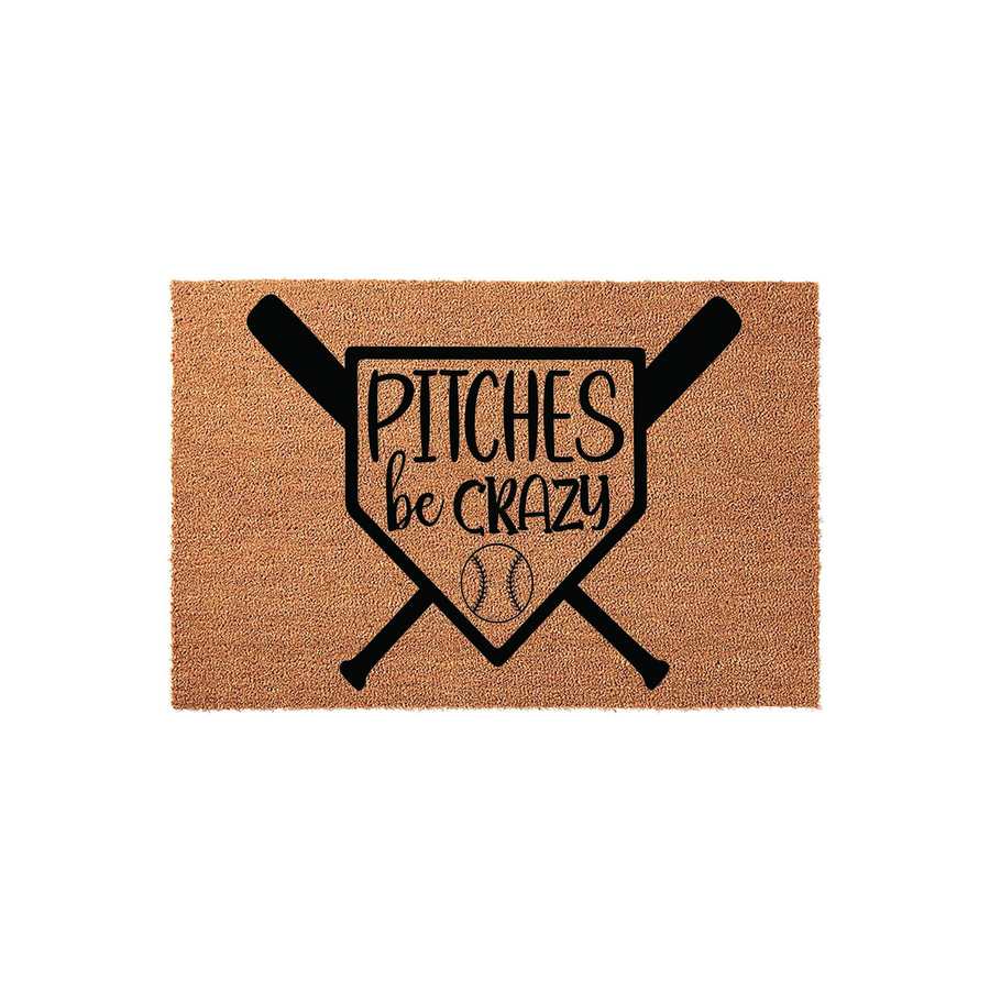 Baseball themed coir doormat featuring a home plate graphic with crossed bats and a baseball, printed with the humorous text Pitches be Crazy in black ink against the natural brown textured fiber background of this outdoor