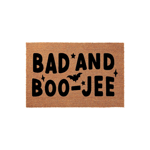 Bad and Boojee Halloween doormat made of natural coir fiber, featuring bold black text with a bat silhouette and star accents, perfect for adding a spooky and stylish touch to your front porch decor during the autumn holiday