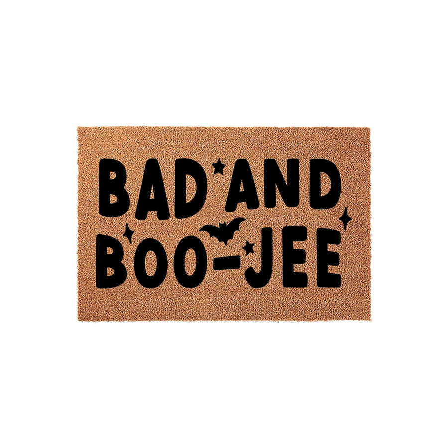 Bad and Boojee Halloween doormat made of natural coir fiber, featuring bold black text with a bat silhouette and star accents, perfect for adding a spooky and stylish touch to your front porch decor during the autumn holiday