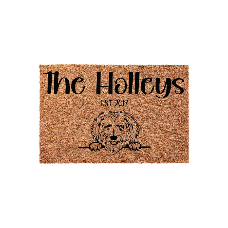 Personalized Doodle Dog Welcome Doormat featuring a shaggy dog illustration peeking over a line, customized with a family name and established year on a natural brown coir fiber background for a charming front porch entryway