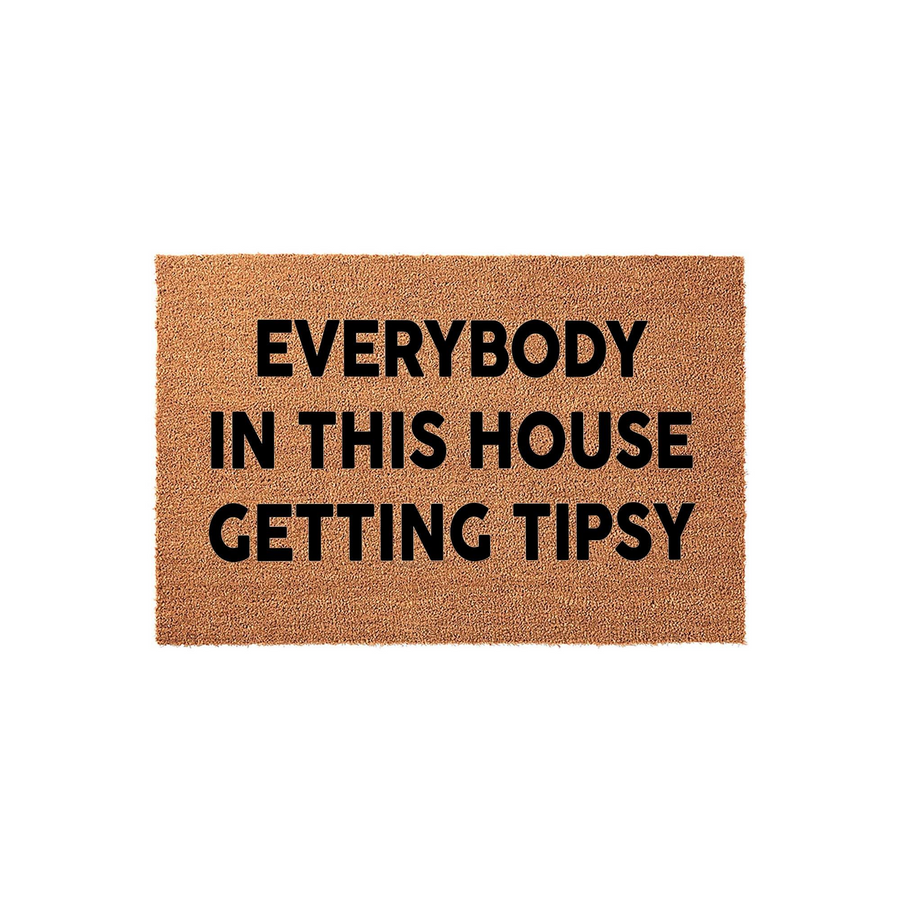 Funny Everybody In This House Getting Tipsy doormat featuring bold black text printed on a natural brown coir fiber mat, creating a humorous and welcoming entrance decor piece for your front porch or home entryway on a plain