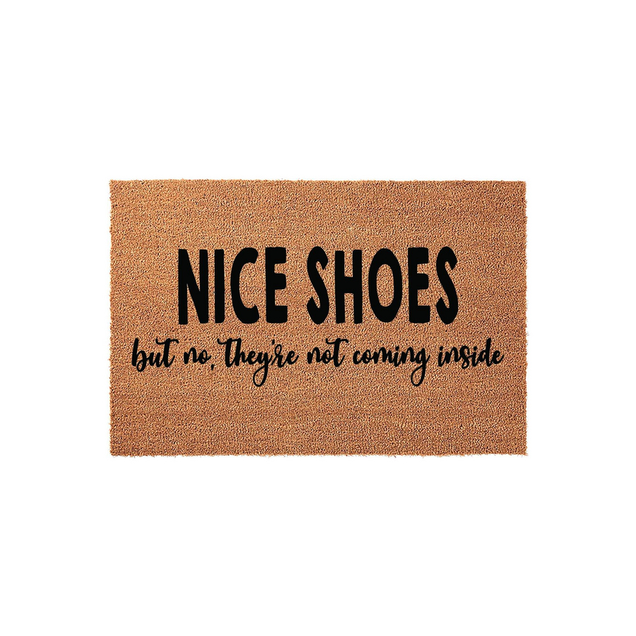 Funny Nice Shoes Doormat made of natural coir fiber, featuring bold black text that reads Nice Shoes but no, They are not coming inside, set against a clean white background for a modern and welcoming home entryway decor style.