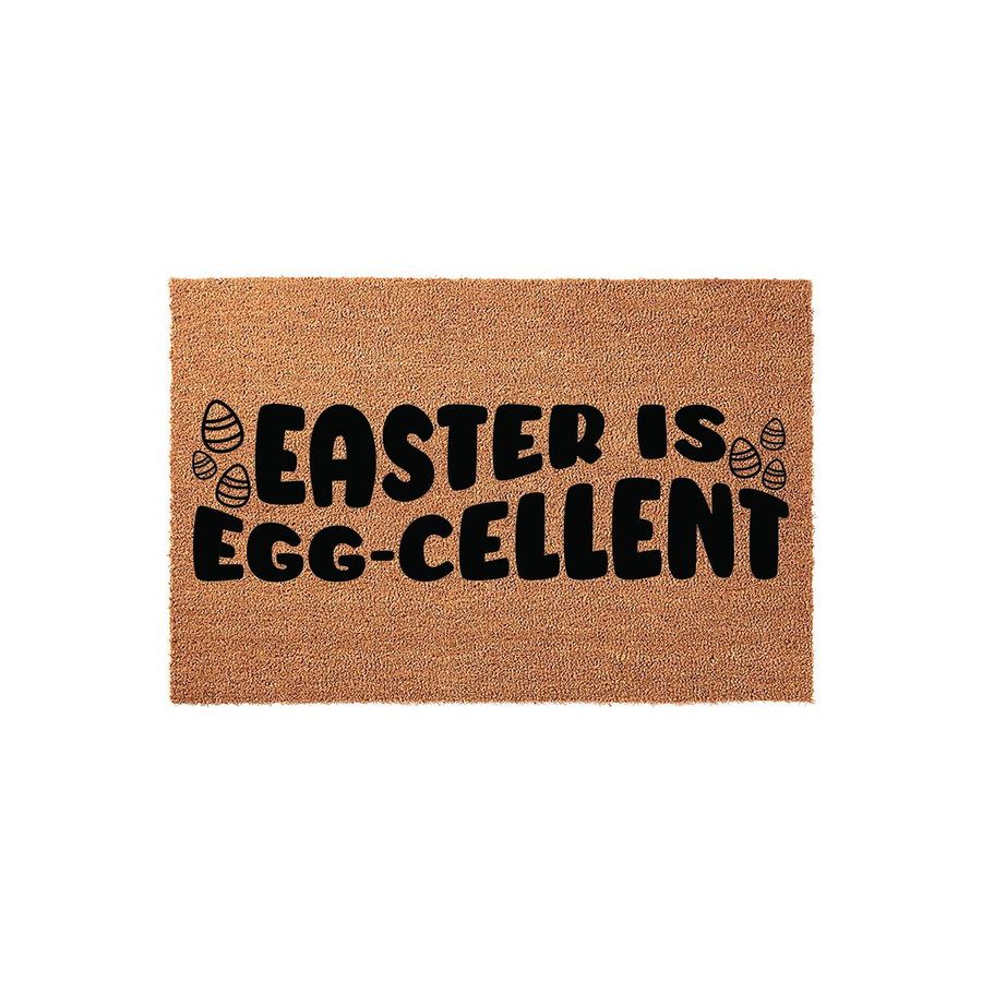 Easter Is Egg-Cellent coir doormat featuring bold black text and small decorative egg icons on a natural brown fiber background, creating a festive spring entryway decor piece for your front porch during the holiday season.