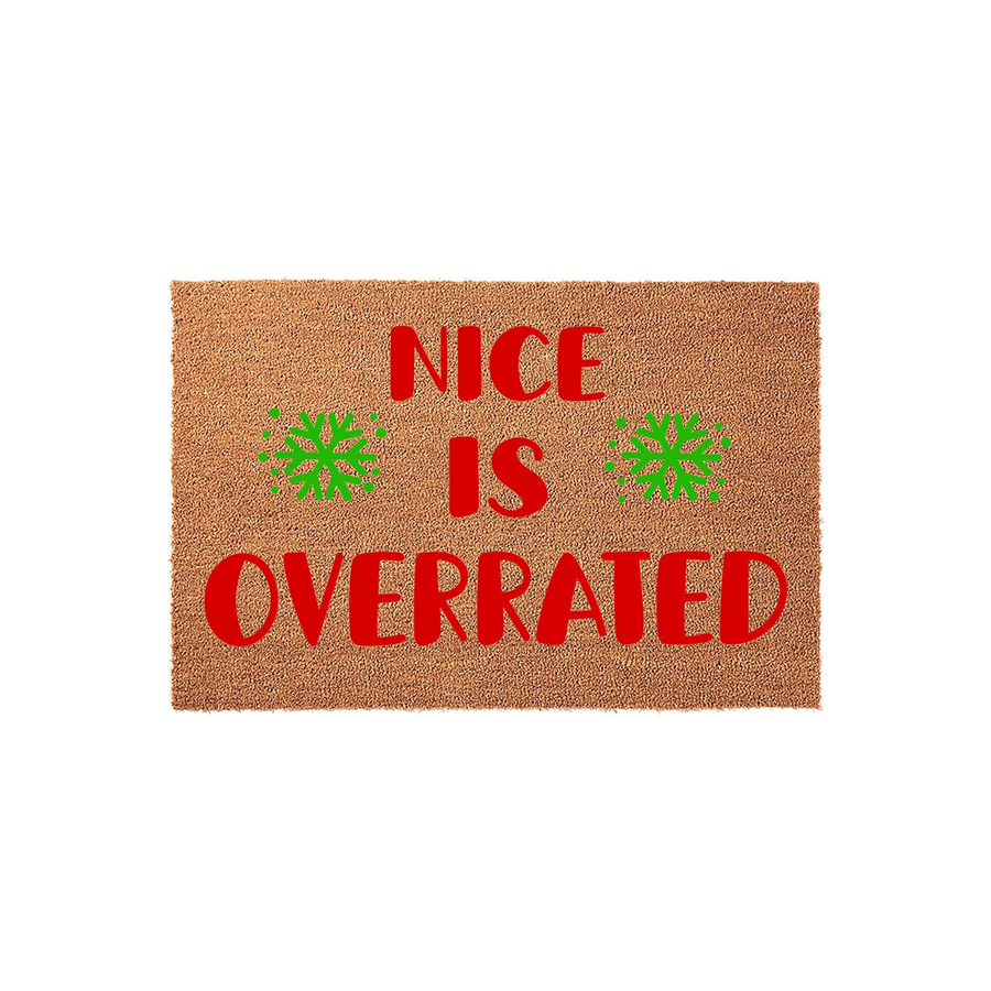 Nice Is Overrated Christmas Doormat featuring a natural coir texture with bold red text and bright green snowflake accents, creating a humorous and festive holiday welcome for your front porch or entryway decor during the winter