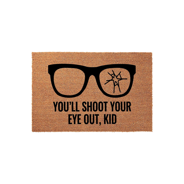 Funny Christmas Movie Quote Doormat featuring a graphic of black glasses with one cracked lens and the iconic text You'll Shoot Your Eye Out, Kid printed in bold black letters on a natural brown coir fiber welcome mat for your