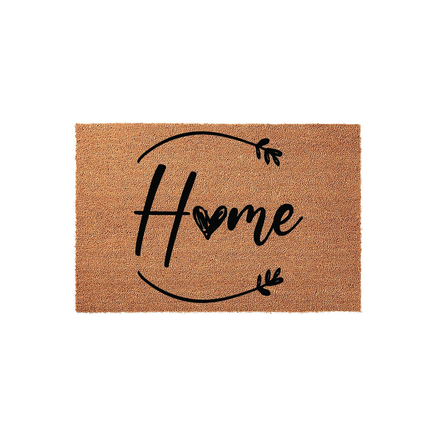 Home coir doormat featuring a rustic script font with a heart replacing the letter o, surrounded by a simple circular vine design on a natural tan fiber background, creating a welcoming entryway decor piece for any modern
