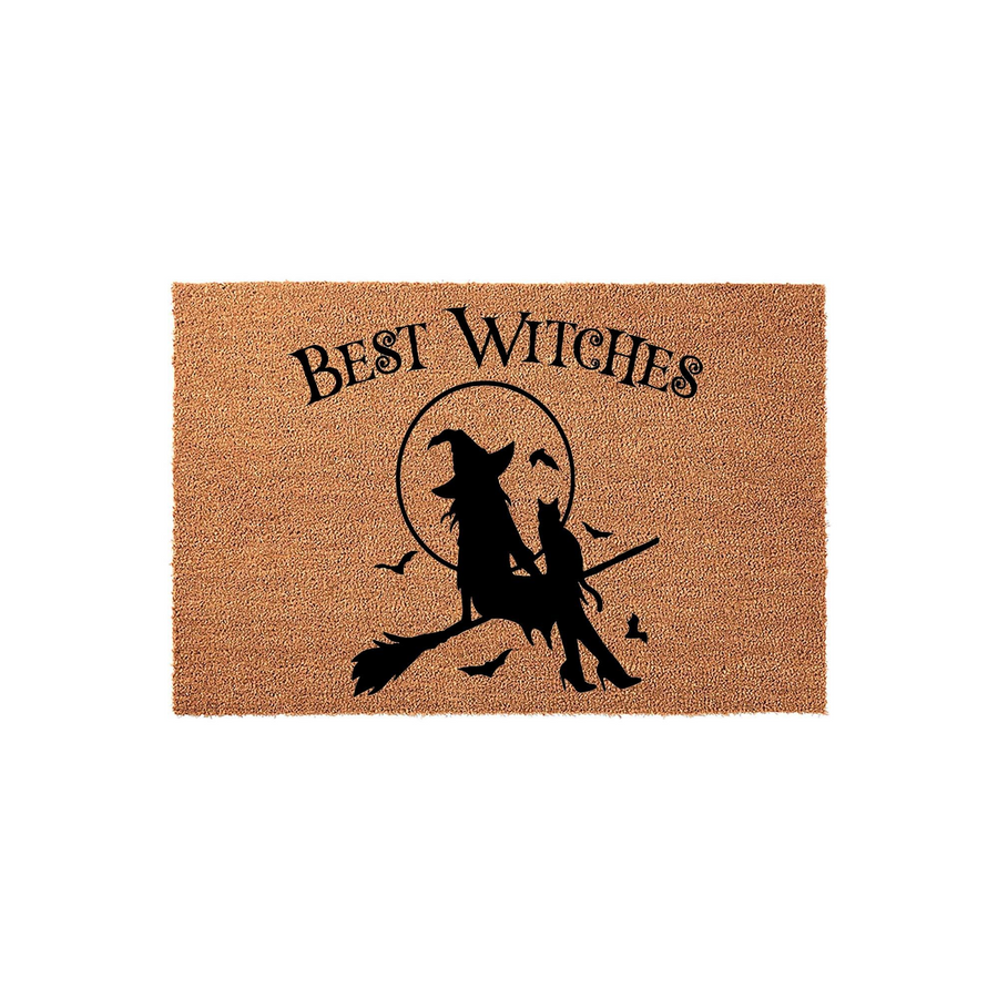 Best Witches Halloween coir doormat featuring a black silhouette of a witch riding a broomstick with a cat against a full moon background, printed on a natural tan textured fiber surface for a festive seasonal entryway decoration.