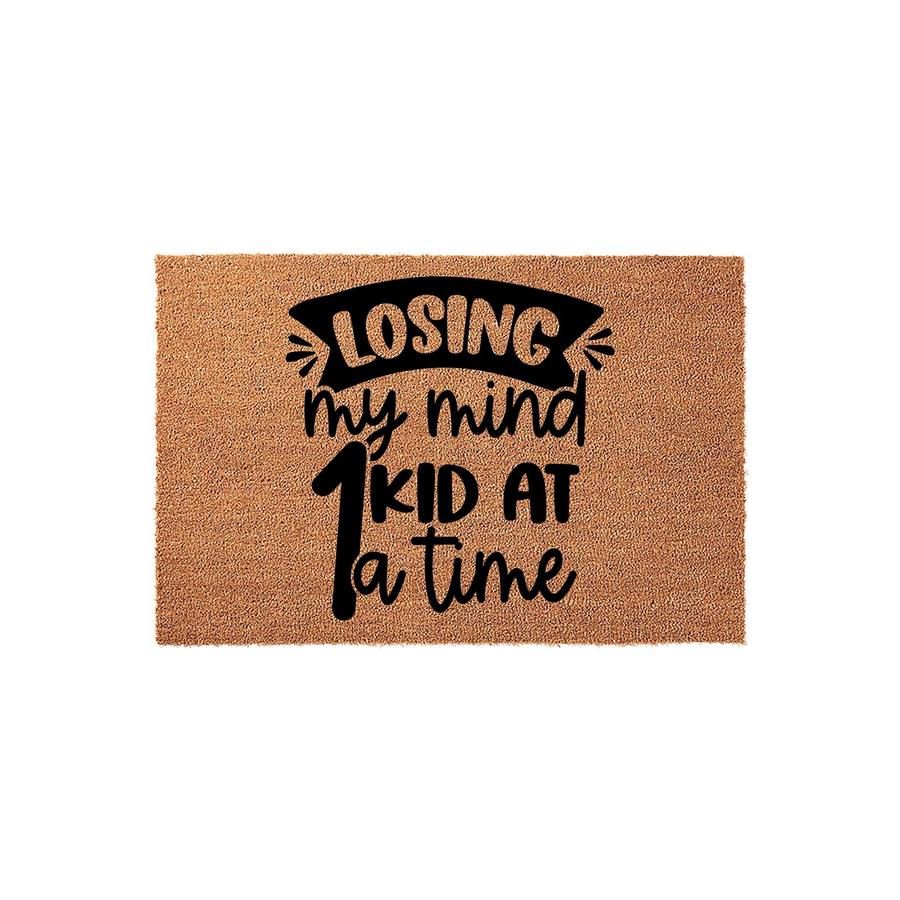 Losing My Mind One Kid At A Time coir doormat featuring bold black typography on a natural tan fiber background, creating a humorous and relatable entryway decor piece for busy parents who want a funny welcome mat for their front