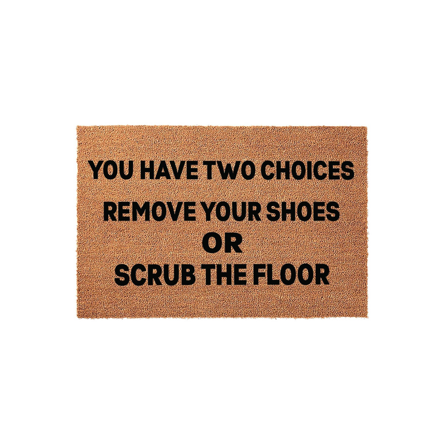 Funny Remove Your Shoes Doormat made of natural coir fiber, featuring bold black text that reads You Have Two Choices, Remove Your Shoes Or Scrub The Floor, set against a clean white studio background for a modern home entryway.