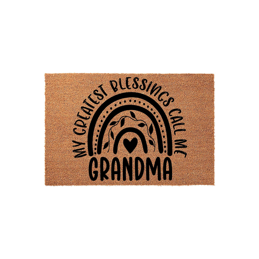 Grandma coir doormat featuring a black printed rainbow design with leaf accents and a heart, surrounded by the text My Greatest Blessings Call Me Grandma, set against a plain white background for a clean and welcoming entryway