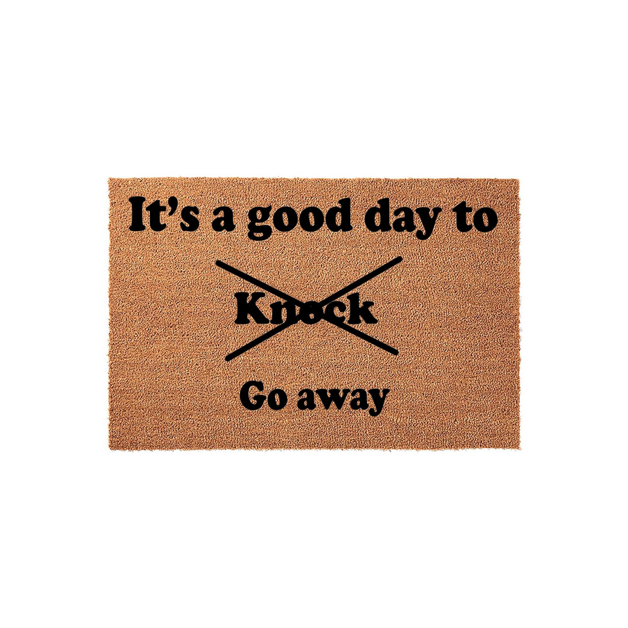 Funny coir doormat featuring the text It is a good day to Knock with a black X through the word Knock and the phrase Go away printed below, creating a humorous and sarcastic welcome mat for your front porch or entryway decor.