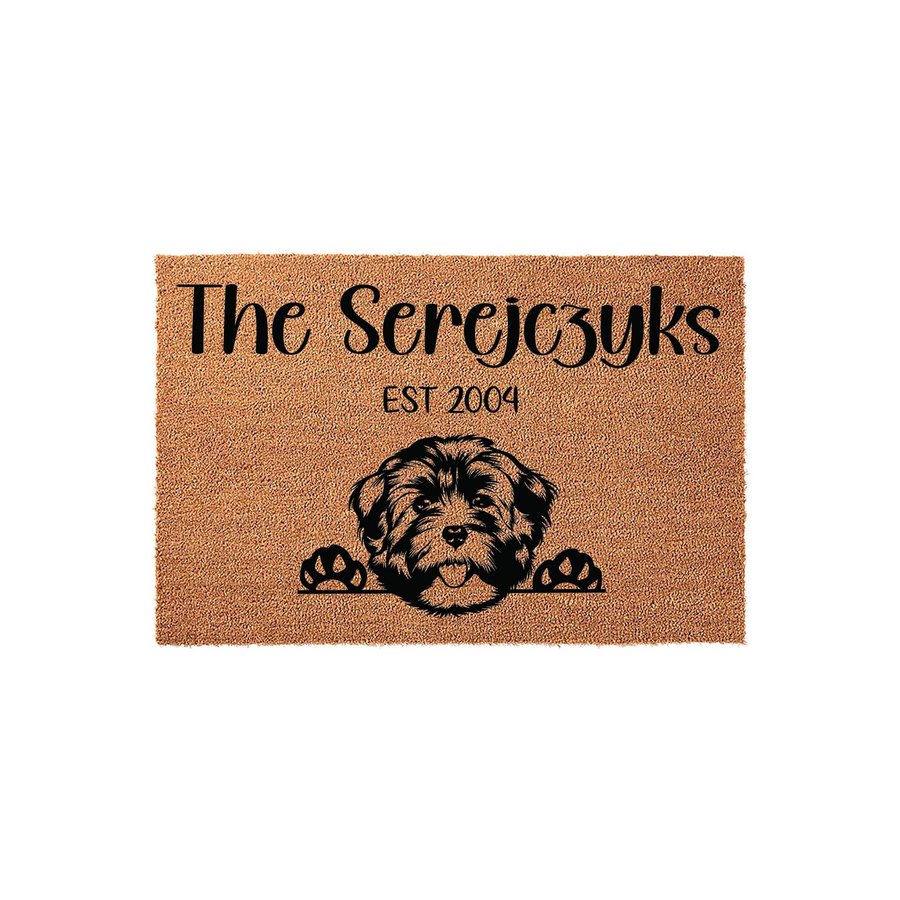 Personalized Havanese dog doormat featuring a cute illustrated puppy peeking over the bottom edge, with custom family name and established year text printed in black on a natural brown coir fiber mat against a clean white