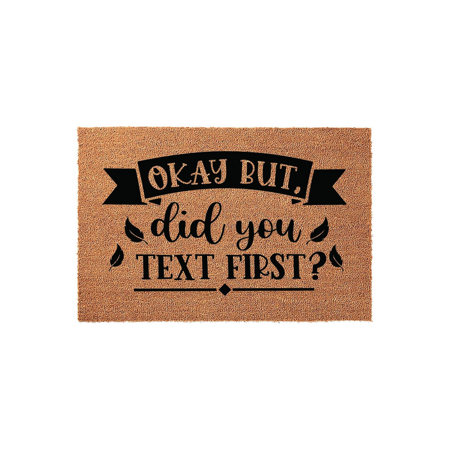 Funny Okay But Did You Text First Coir Doormat featuring bold black typography on a natural tan coconut fiber background, creating a humorous and welcoming entrance decor piece for any modern home front porch or entryway floor.