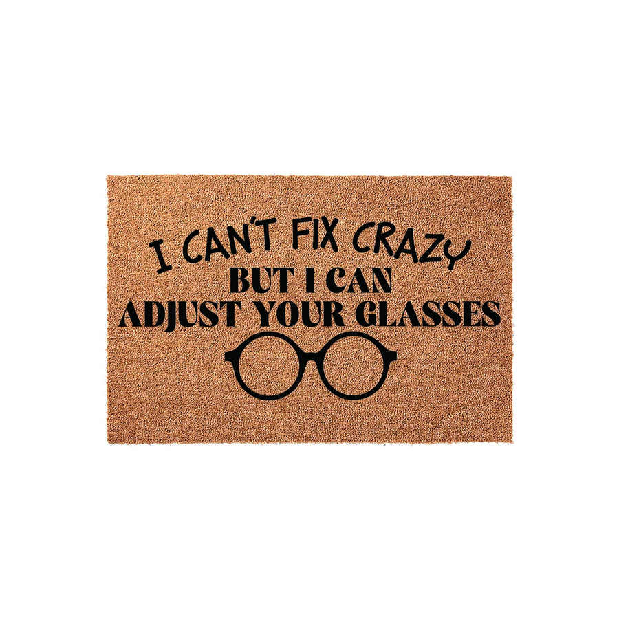 Funny Optometrist Coir Doormat featuring the text I Can't Fix Crazy But I Can Adjust Your Glasses printed in bold black lettering above a graphic of round eyeglasses on a natural brown textured fiber background for a home