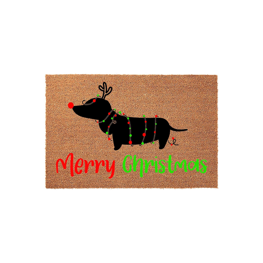 Dachshund Christmas doormat featuring a black silhouette of a dog wrapped in festive red and green string lights with reindeer antlers, set against a natural coir background with the words Merry Christmas printed in colorful
