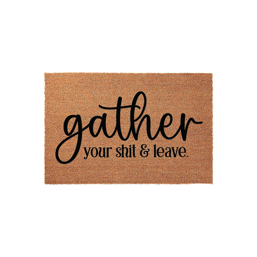 Funny coir doormat featuring the text gather your shit and leave in a mix of elegant script and clean serif fonts, displayed on a plain white background as a humorous outdoor entrance mat for a modern home entryway or front porch.