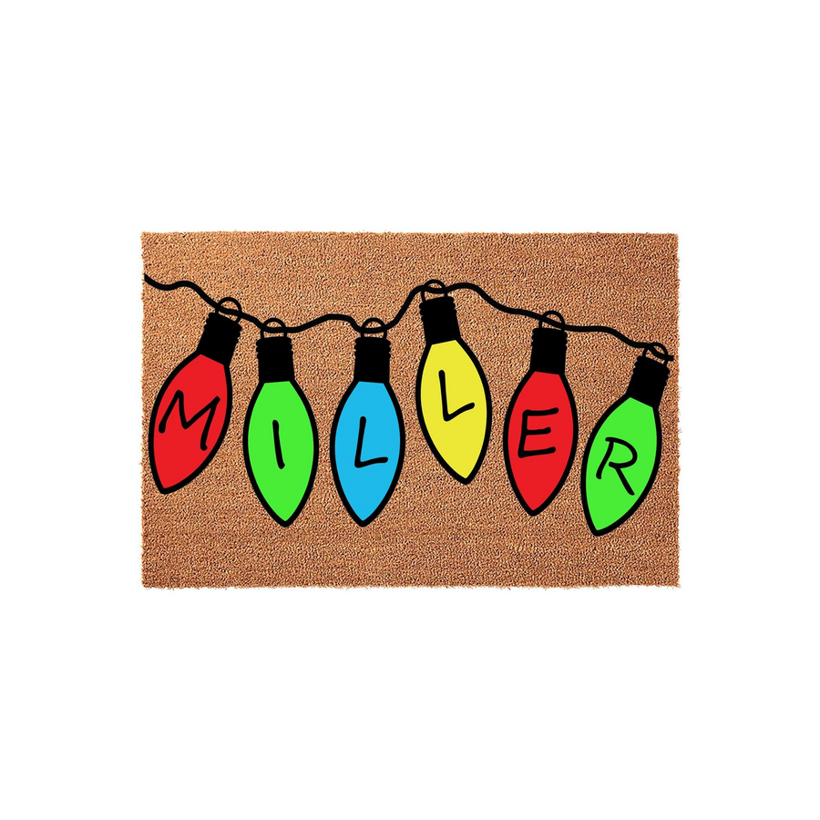 Personalized Christmas doormat featuring a string of colorful holiday lights, with each bulb displaying a letter to spell out a family name on a natural coir background, creating a festive entryway decor piece for the winter