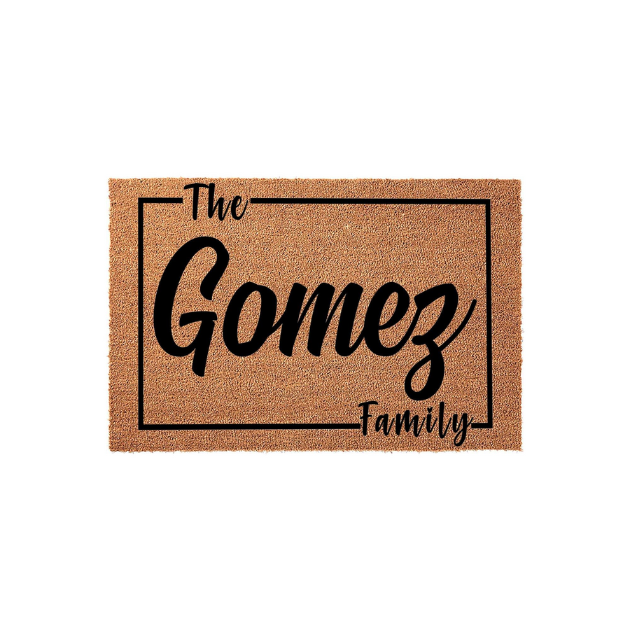 Personalized family name coir doormat featuring a clean black rectangular border and elegant script typography that displays the text The Family, providing a welcoming and durable entrance mat for any home front porch or entryway.