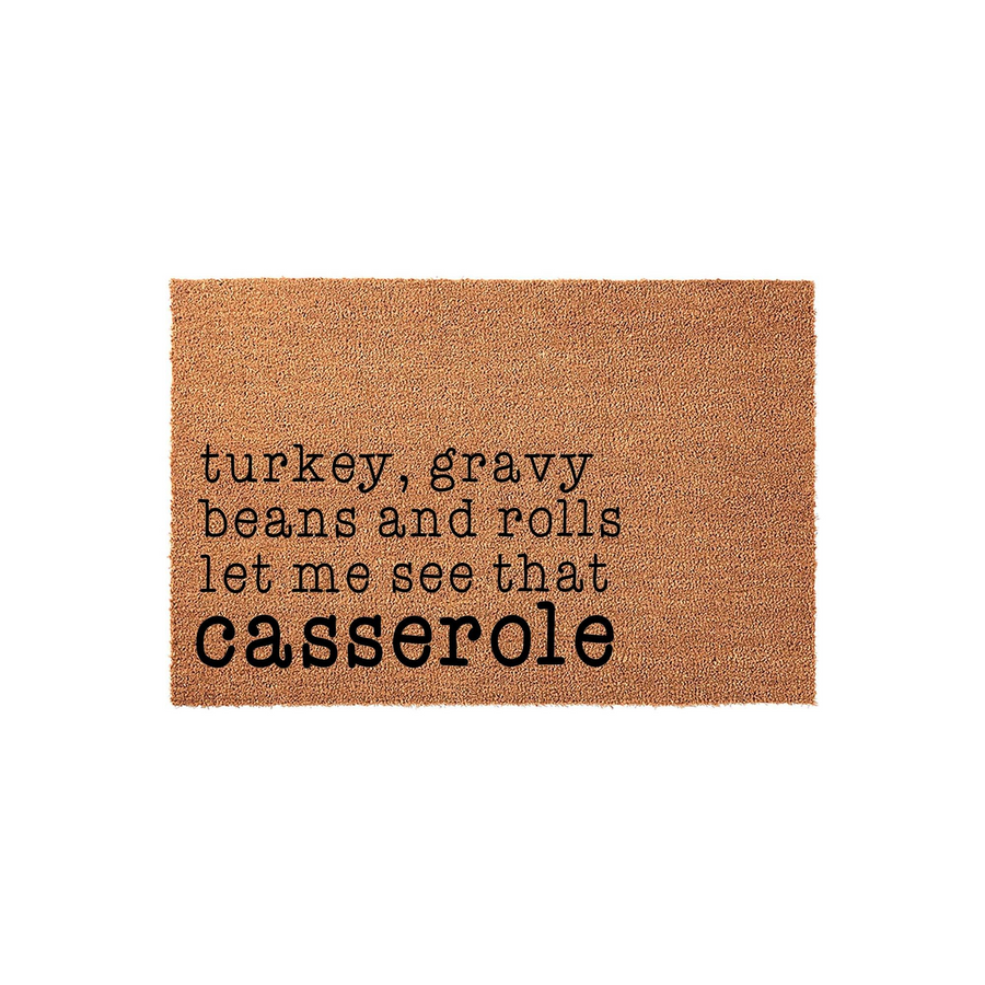 Funny Thanksgiving doormat featuring natural coir fibers and black typewriter-style text that reads turkey, gravy, beans and rolls let me see that casserole, making it a humorous seasonal home decor piece for your front porch