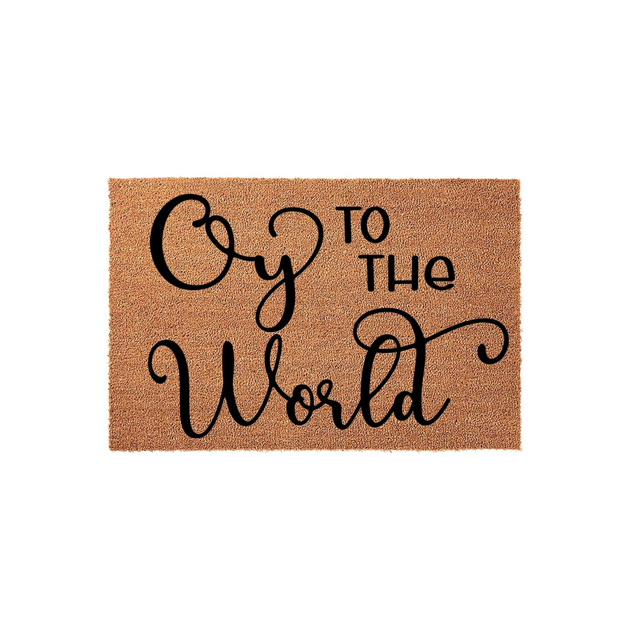 Oy To The World Christmas Doormat featuring a natural coir fiber texture with bold black script lettering, making a festive holiday entrance rug for your front porch decor during the winter season and holiday celebrations.