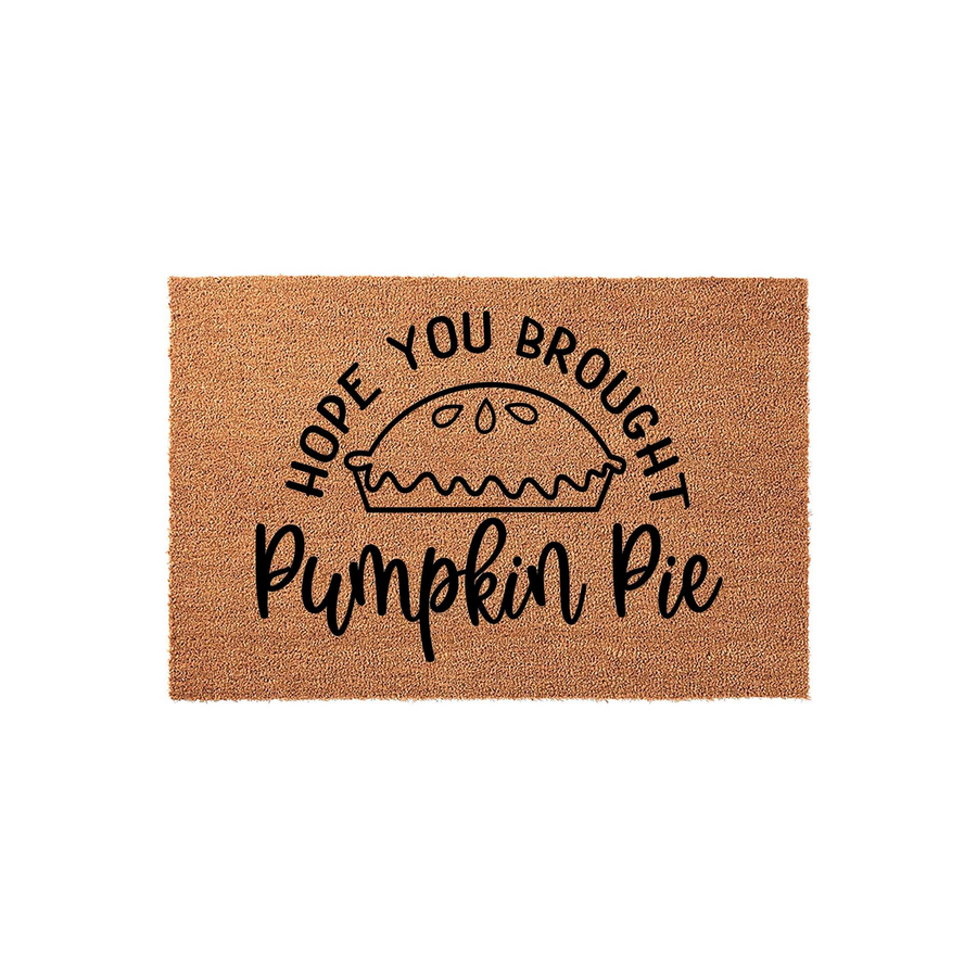 Hope You Brought Pumpkin Pie coir doormat featuring a cute hand-drawn pie illustration and festive black typography, making this a fun and welcoming fall front porch decor piece for your home entrance during the autumn holiday