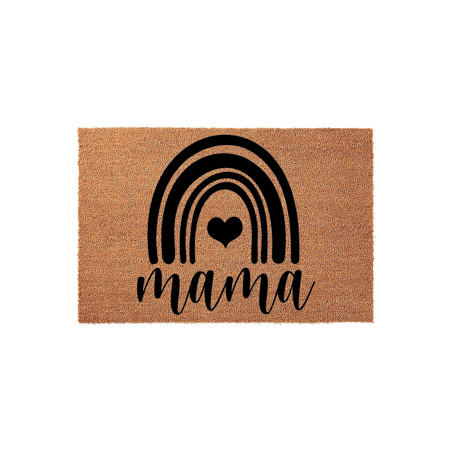 Mama coir doormat featuring a black printed rainbow design with a central heart icon, set against a plain white background to highlight the natural fiber texture and the elegant script lettering of the word mama on the front