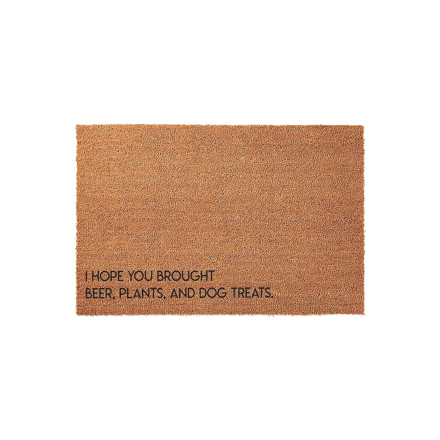 Funny coir doormat featuring the text I Hope You Brought Beer, Plants, and Dog Treats printed in black ink on a natural brown fiber background, making it a humorous welcome mat for any home entrance or front porch decor.