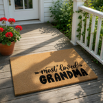 Most Loved Grandma coir doormat featuring a natural fiber welcome mat design with black script text, perfect for a front porch entry or home decor, celebrating a special grandmother with this durable outdoor floor mat for the