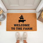 Welcome to the Farm coir doormat featuring a stacked silhouette of a cow, sheep, pig, and rooster, perfect for rustic farmhouse porch decor and outdoor entryway floor mats that add a charming country touch to your home entrance.