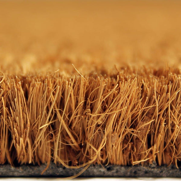 A close-up view of a textured surface, possibly a woven material or a natural plant fiber, with a warm, golden-brown color.