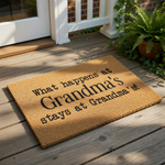 Grandma doormat with funny quote, a natural coir fiber welcome mat for the front porch featuring black text that reads What happens at Grandma's stays at Grandma's, a durable outdoor floor rug for a home entryway or housewarming
