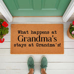 Grandma doormat with funny quote on a natural coir welcome mat, placed on a front porch with green door and flowers.