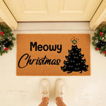 Meowy Christmas cat doormat for front porch decor, featuring a festive black cat tree design on natural coir fiber.