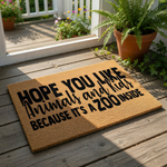 Funny animal and kids doormat with bold black text on a natural coir fiber welcome mat, featuring a humorous quote about a zoo inside for a family home entrance, perfect for a front porch or housewarming gift for parents.