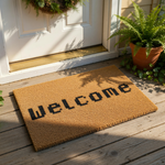 Pixel font Welcome doormat made of natural coir fiber, featuring a retro gaming style text design on a durable outdoor welcome mat for your front porch entrance, perfect for a gamer home decor look and housewarming entry way